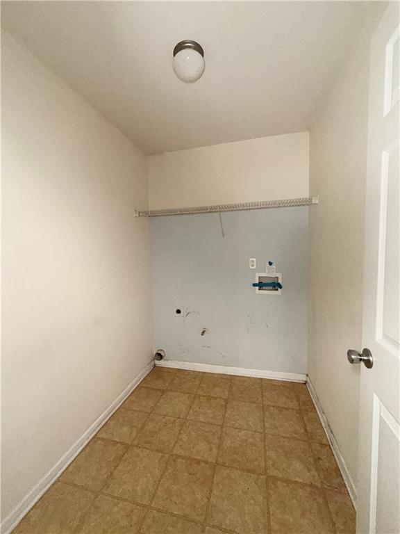 620 Superior Way Fairburn, GA 30213 - Photo 18 of 27 a view of a room with racks on the wall