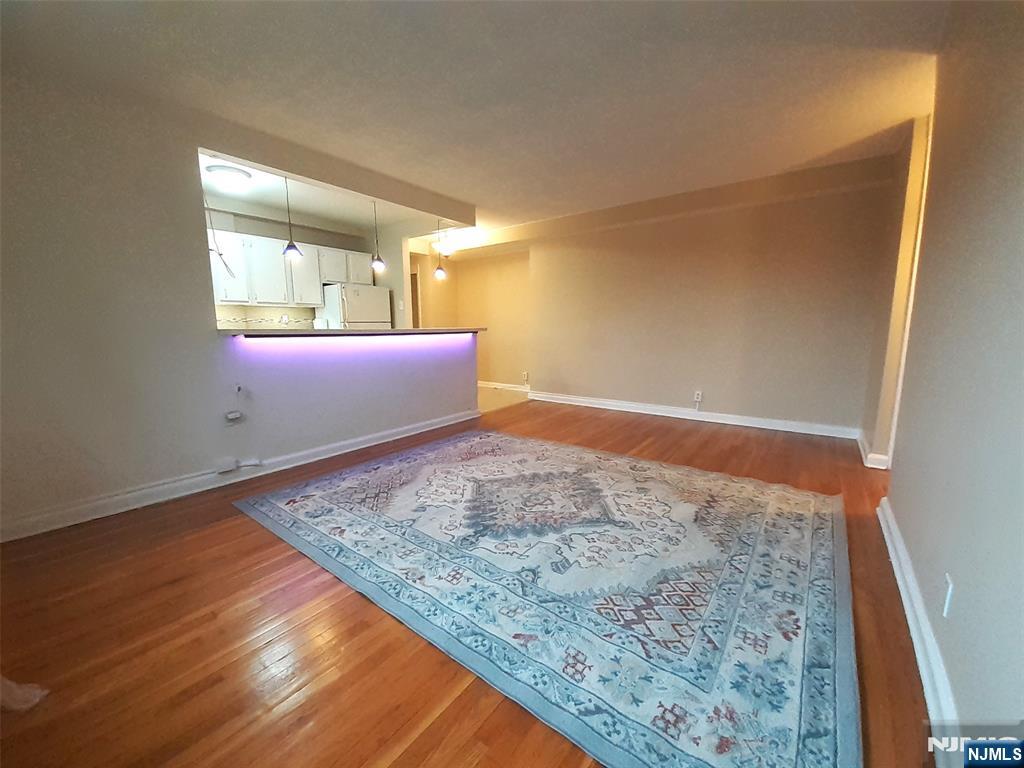 3071 Edwin Avenue, Unit 5G Fort Lee, NJ 07024 - Photo 13 of 21 a view of an empty room and wooden floor
