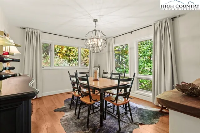 a kitchen with a sink window and cabinets