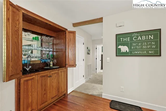 a view of a kitchen with sink and microwave