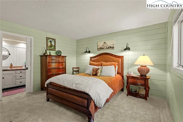 a bathroom with a toilet a sink and a mirror
