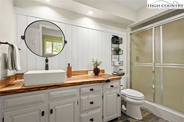 a bedroom with two beds and a table