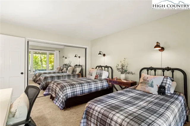 a kitchen with cabinets and wooden floor