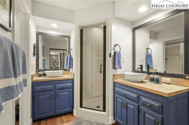 a bedroom with a bed a table and a chair