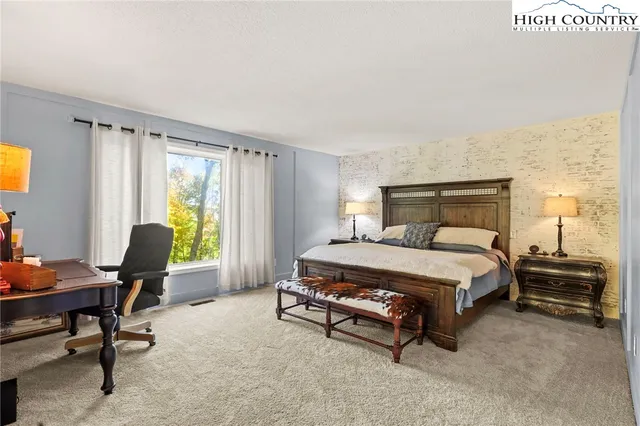 a outdoor space with patio the couches and a dining table with garden view