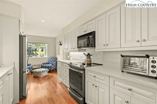 a kitchen with a sink and a window