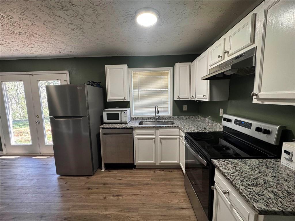 2536 Butner Road Atlanta, GA 30331 - Photo 7 of 19 a kitchen with granite countertop a refrigerator stove and sink