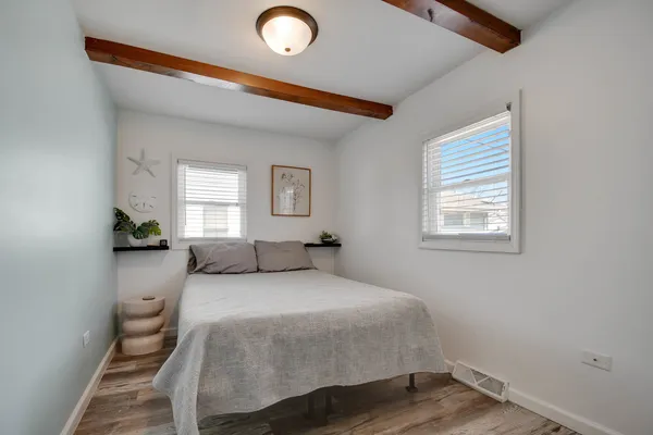 a bedroom with a bed and window