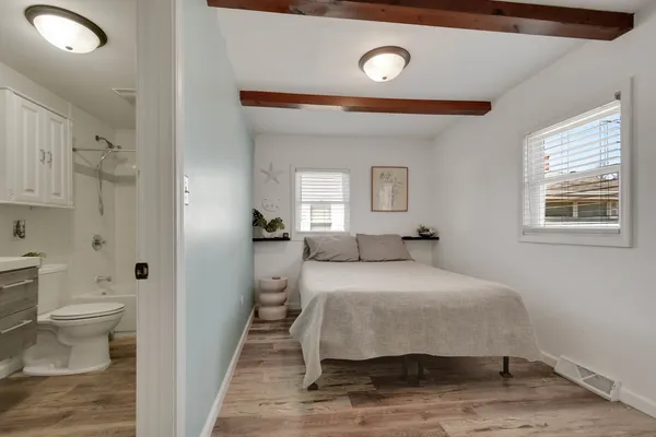 a bedroom with a bed and a view of bathroom