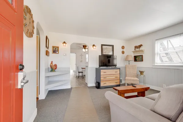a bedroom with furniture and a window