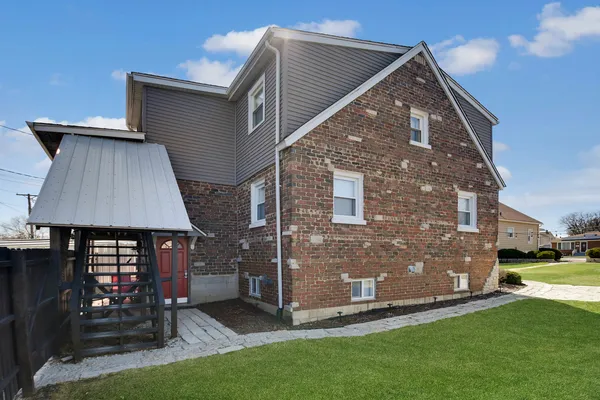 a front view of house with a yard