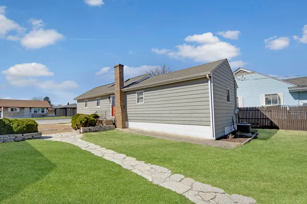 a view of a backyard with sitting area