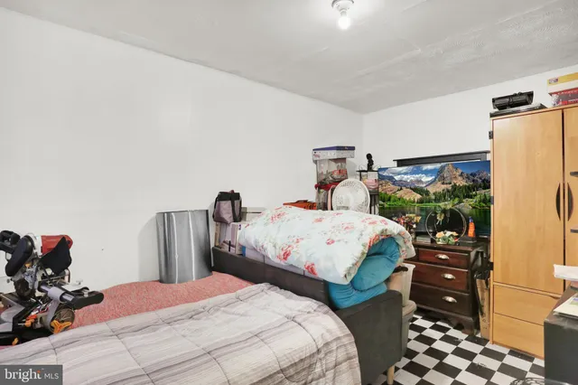 a bedroom with a bed and a cabinets