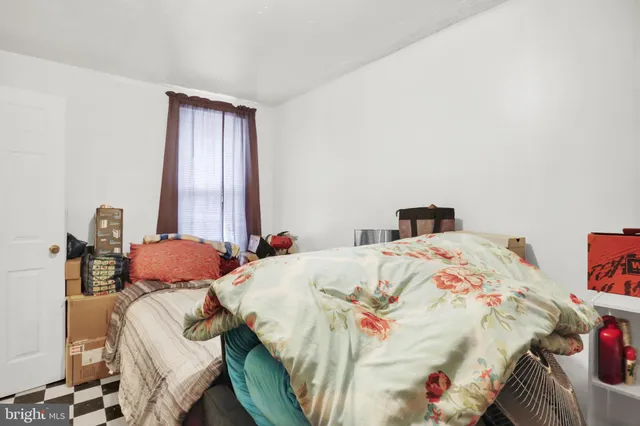 a bedroom with a bed and a table