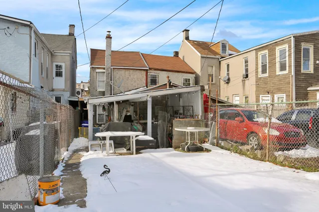 a view of a street with chairs