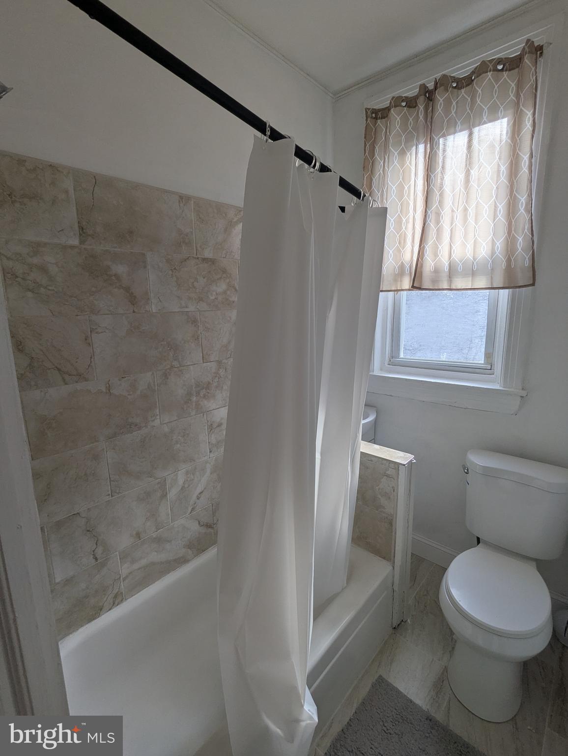 2747 North Judson Street Philadelphia, PA 19132 - Photo 13 of 18 a bathroom with a toilet and a shower