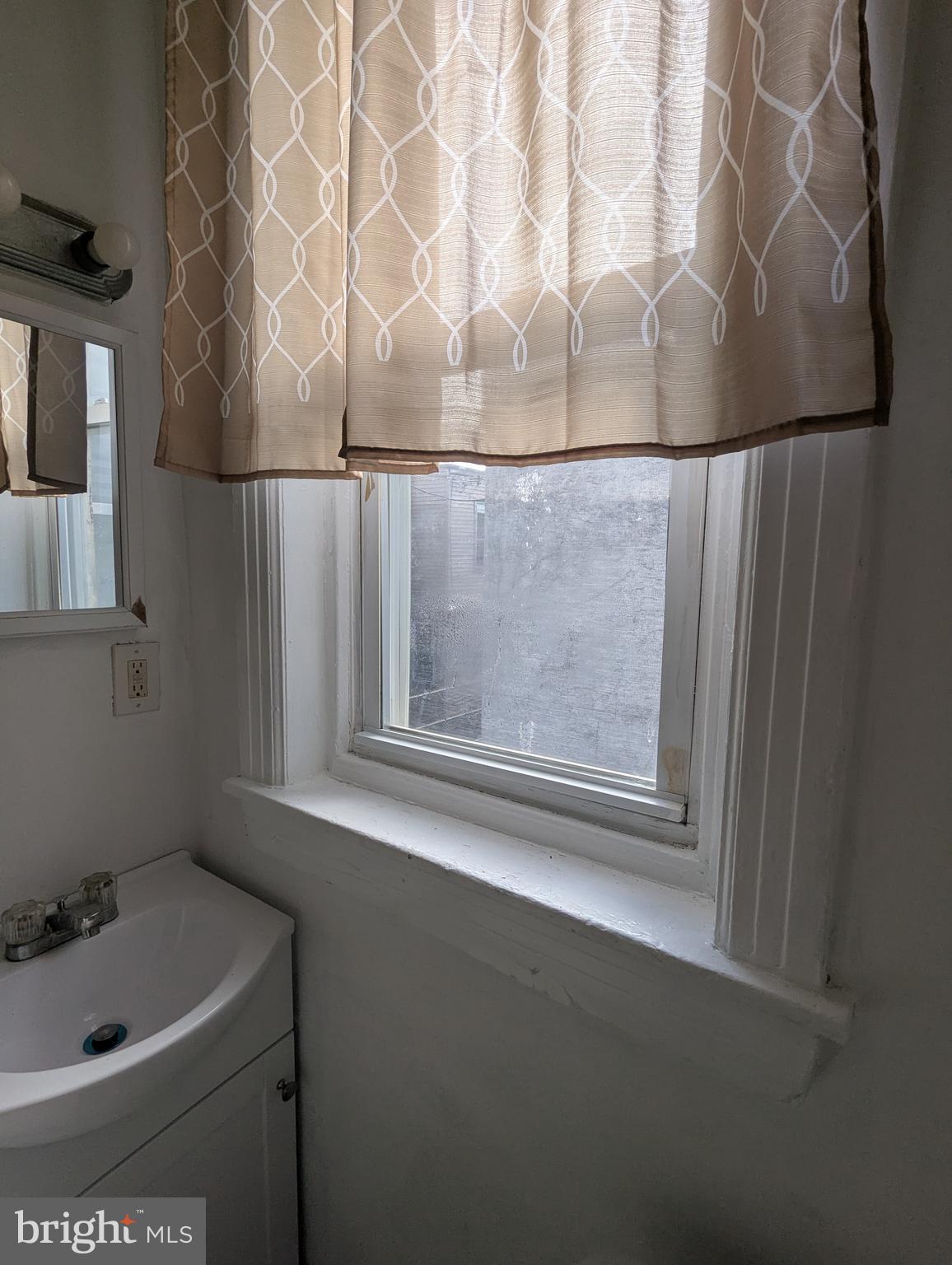 2747 North Judson Street Philadelphia, PA 19132 - Photo 14 of 18 a bathroom with a tub and sink