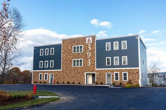a front view of residential houses with yard