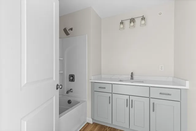 a view of an empty room with a window