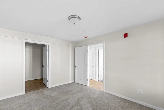 a view of a kitchen from the hallway