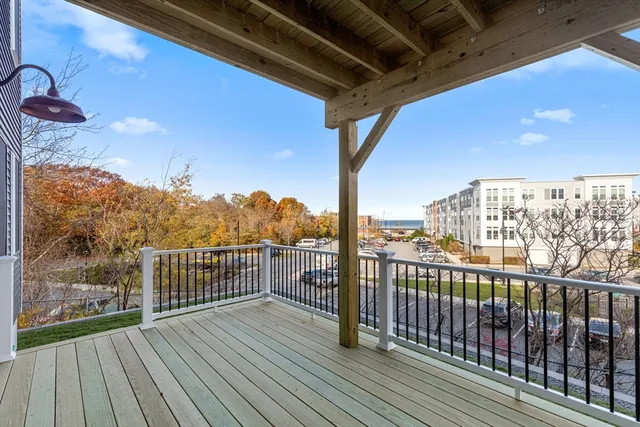 a view of a balcony with wooden floor