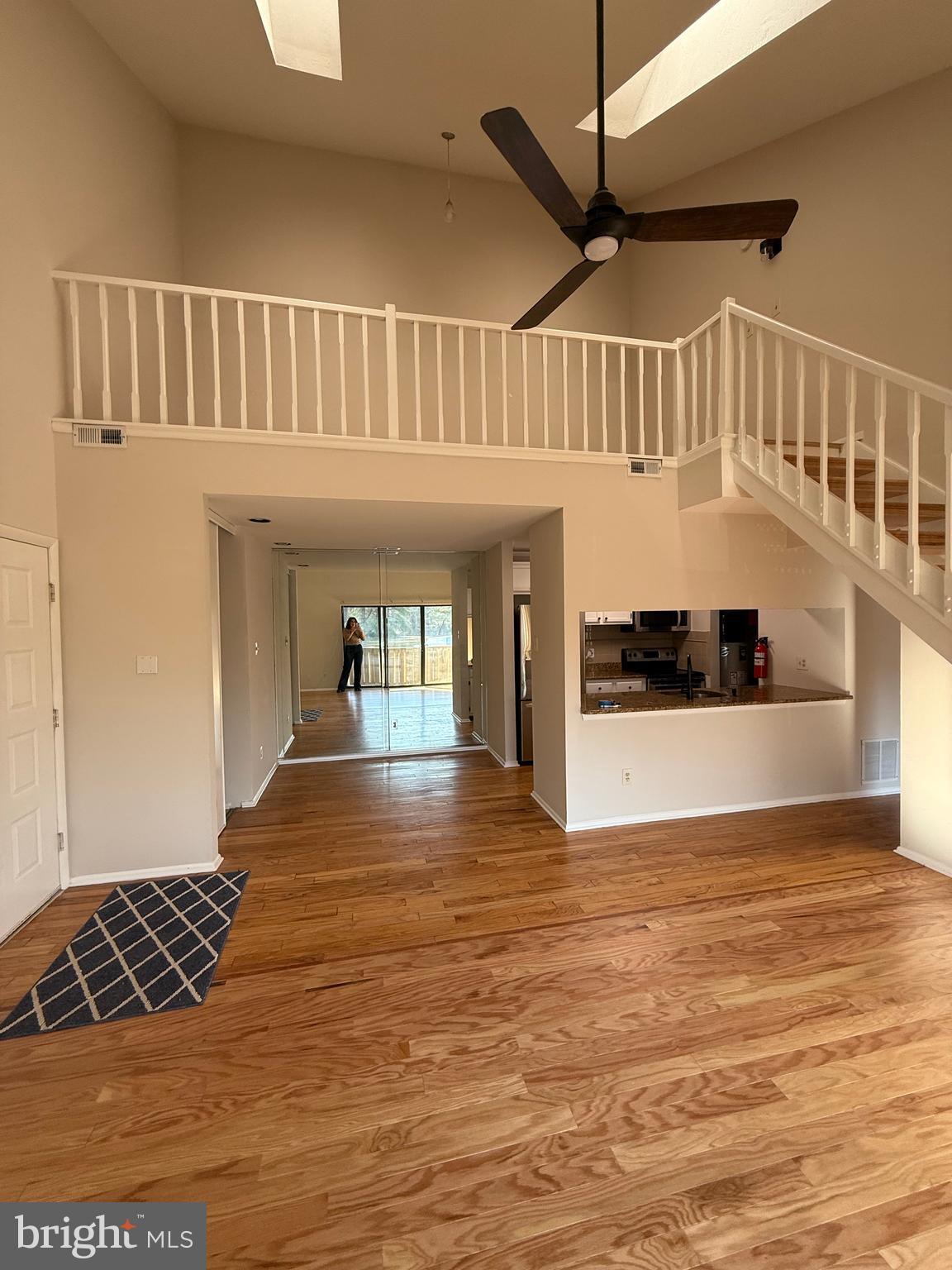 1902 The Woods Cherry Hill, NJ 08003 - Photo 2 of 17 a view of a living room and entryway with wooden floor