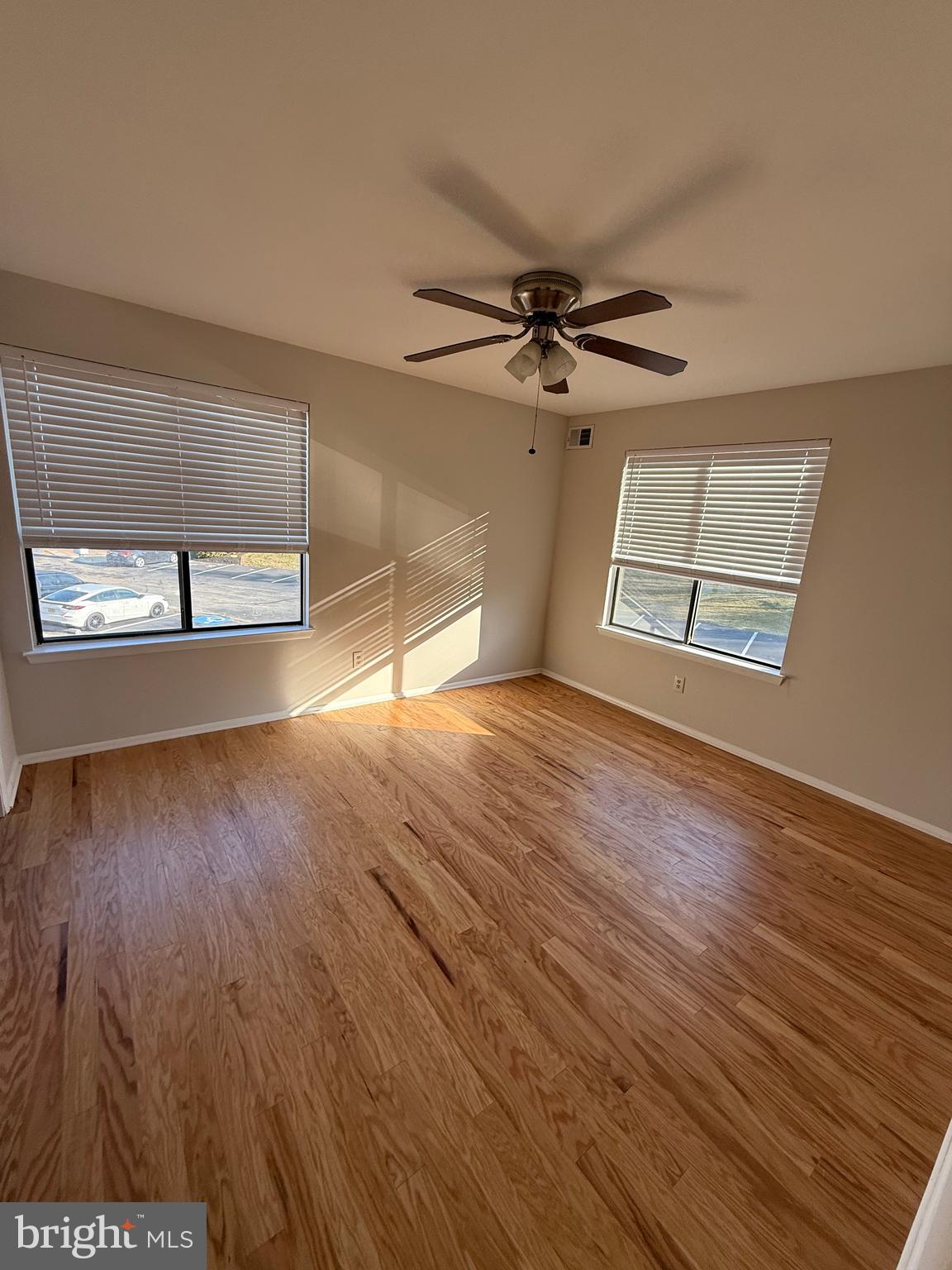 1902 The Woods Cherry Hill, NJ 08003 - Photo 9 of 17 wooden floor in an empty room with a window