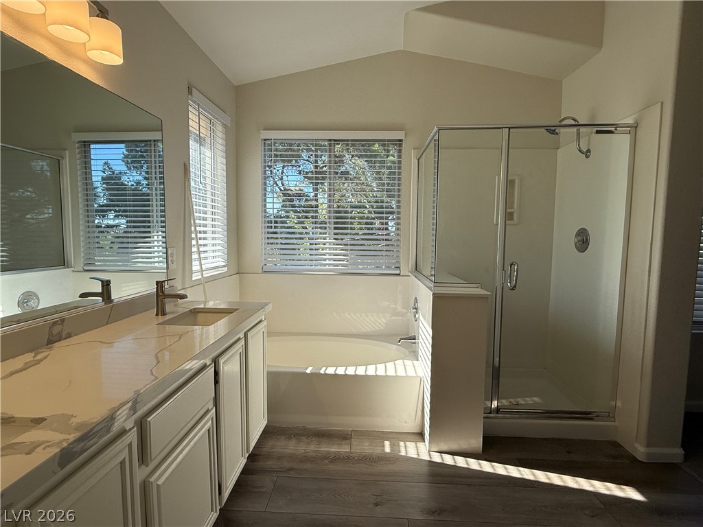 1908 Thunder Ridge Circle Henderson, NV 89012 - Photo 13 of 28 Luxurious primary bathroom retreat featuring a double vanity, separate tub, and walk-in shower.