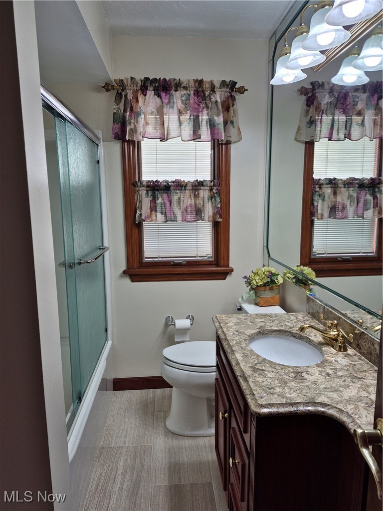 1372 Mayfield Ridge Road Cleveland, OH 44124 - Photo 11 of 37 Bathroom with vanity and a light bar