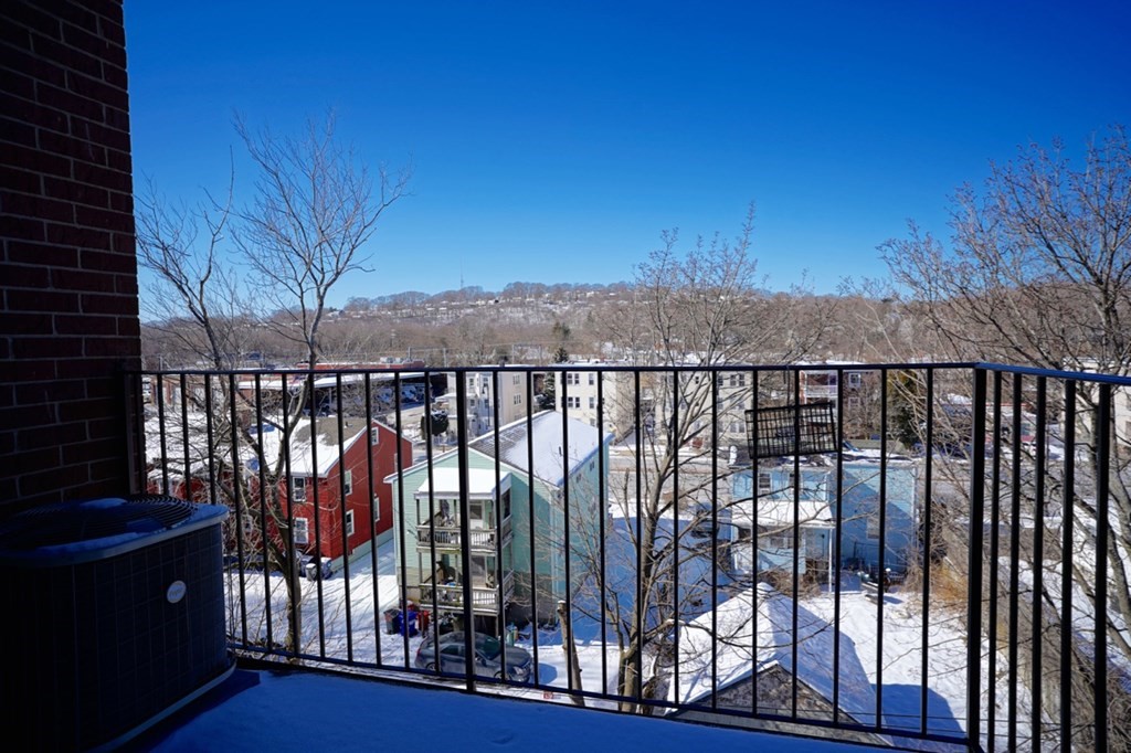 175 Clare Avenue, Unit E8 Boston, MA 02136 - Photo 19 of 25 a view of a balcony with an outdoor space