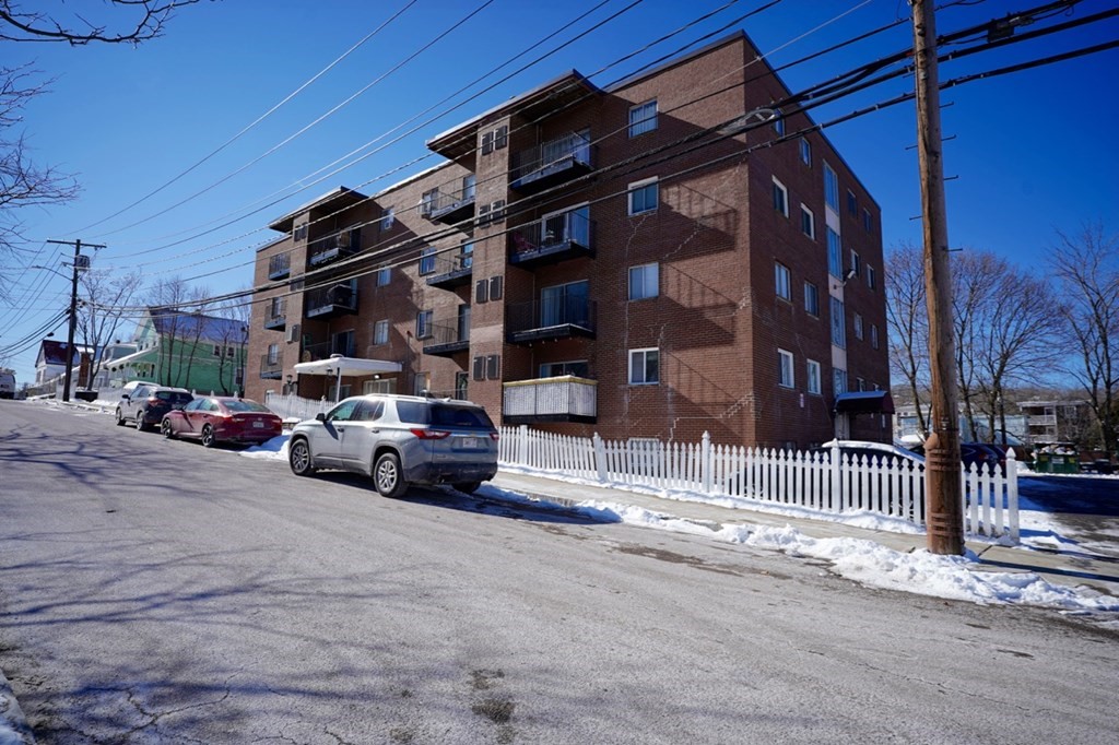 175 Clare Avenue, Unit E8 Boston, MA 02136 - Photo 22 of 25 a view of street with parked cars