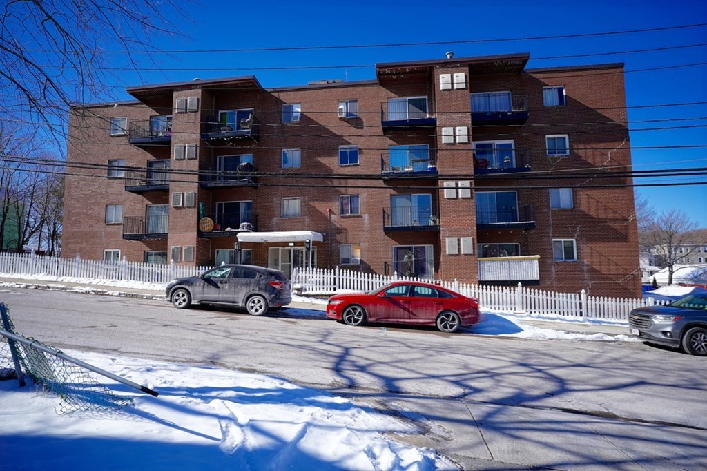 175 Clare Avenue, Unit E8 Boston, MA 02136 - Photo 24 of 25 a car parked in front of a building