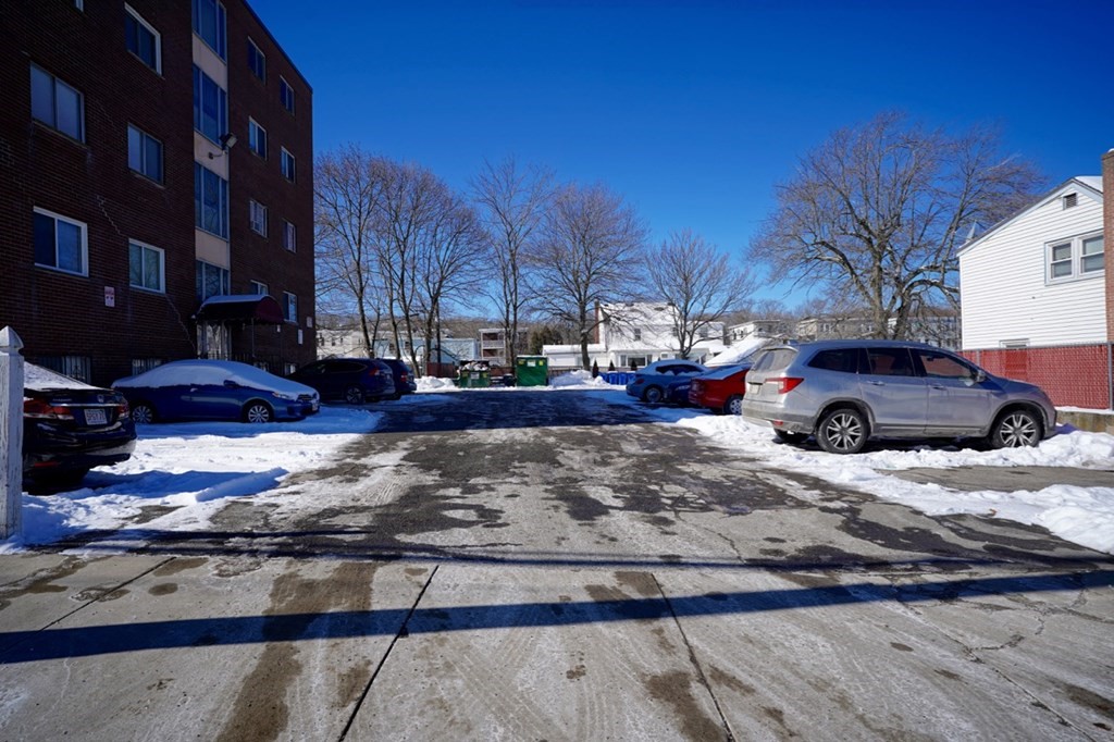 175 Clare Avenue, Unit E8 Boston, MA 02136 - Photo 25 of 25 a front view of a residential apartment building with a yard