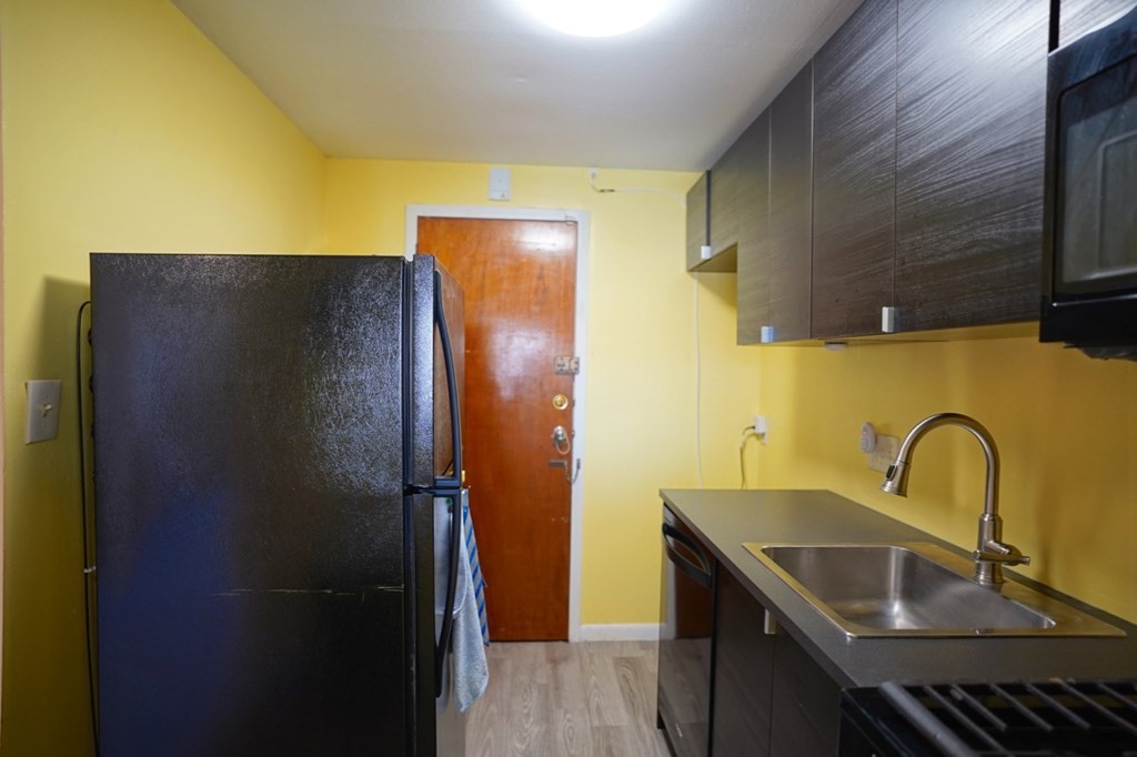 175 Clare Avenue, Unit E8 Boston, MA 02136 - Photo 8 of 25 a bathroom with a sink and a mirror