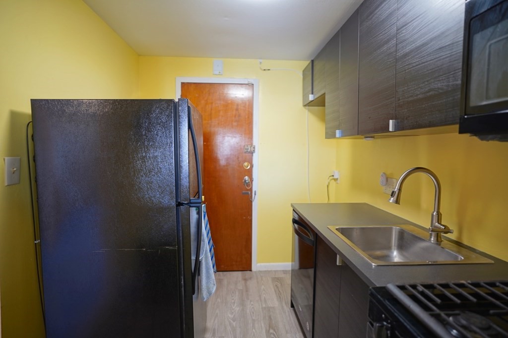 175 Clare Avenue, Unit E8 Boston, MA 02136 - Photo 9 of 25 a bathroom with a sink and a shower