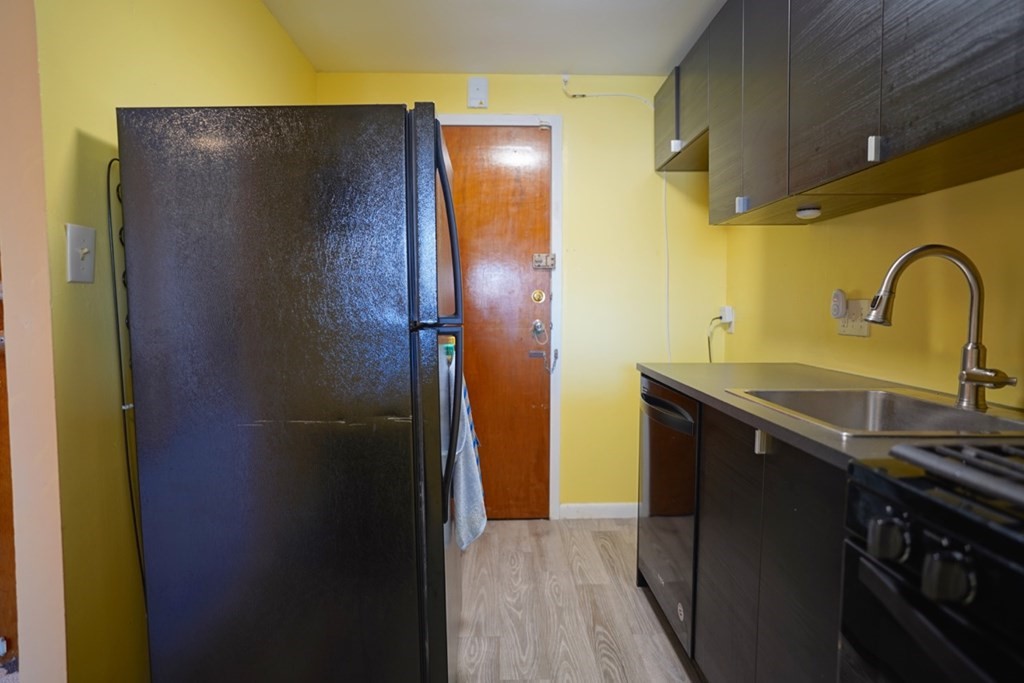 175 Clare Avenue, Unit E8 Boston, MA 02136 - Photo 10 of 25 a bathroom with a sink and mirror