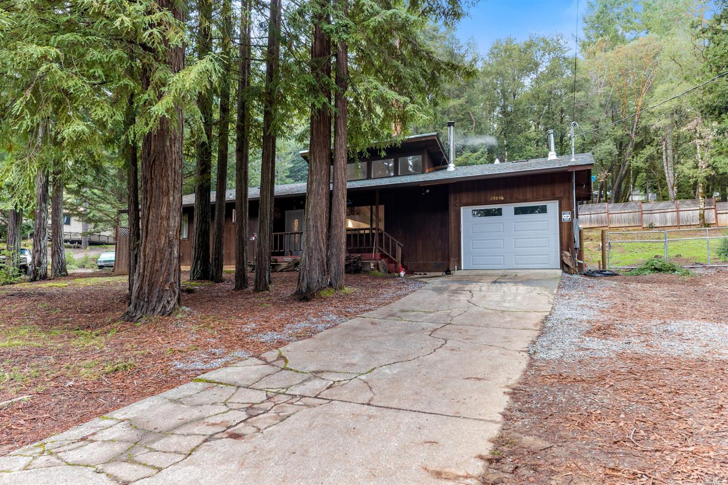 25056 Robin Place Willits, CA 95490 - Photo 1 of 1 a view of a house with a yard and large tree