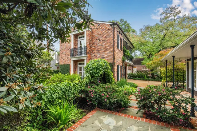 a bathroom with a sink a shower and a window