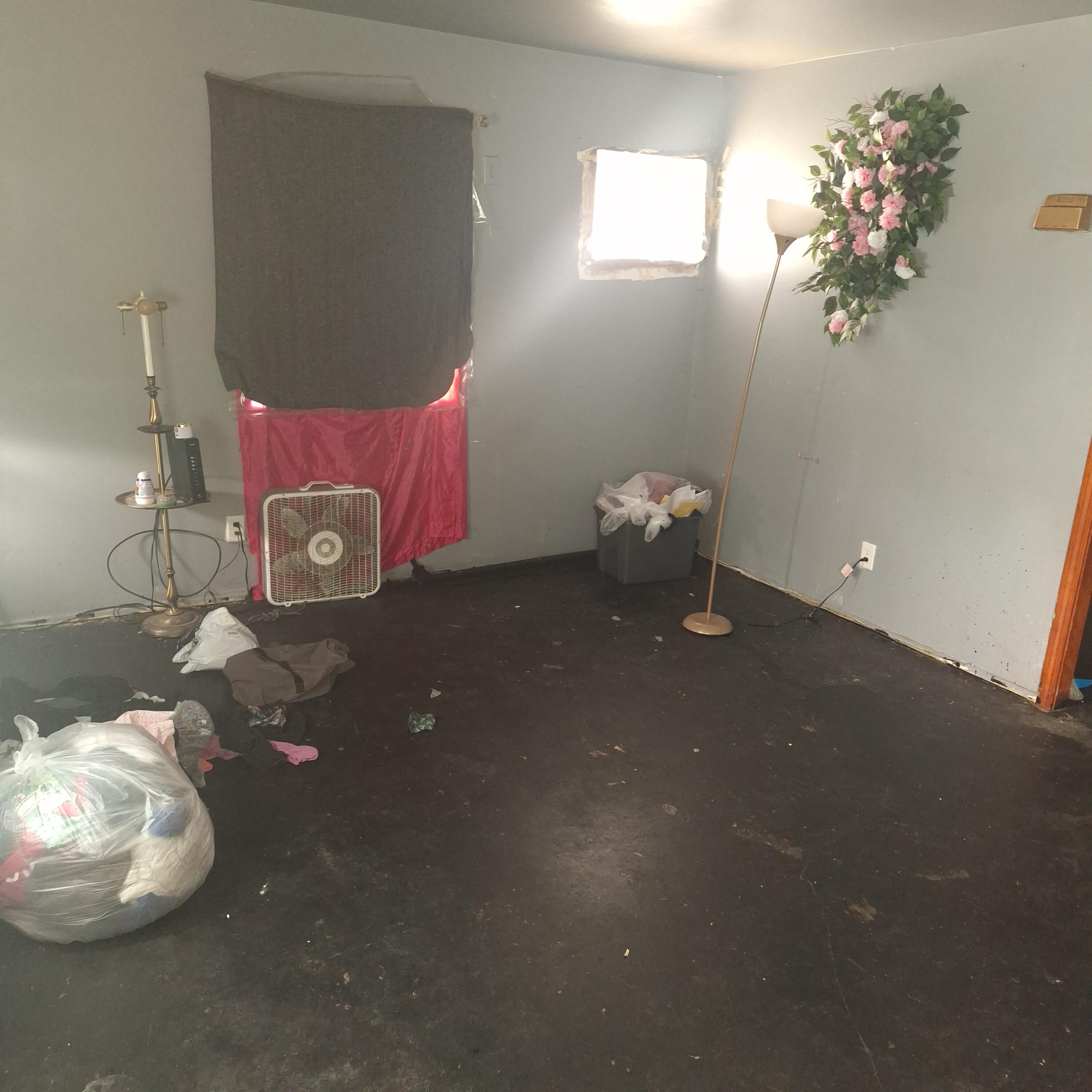 2173 Baker Street Gary, IN 46404 - Photo 2 of 7 a room with water heater and wooden cabinets