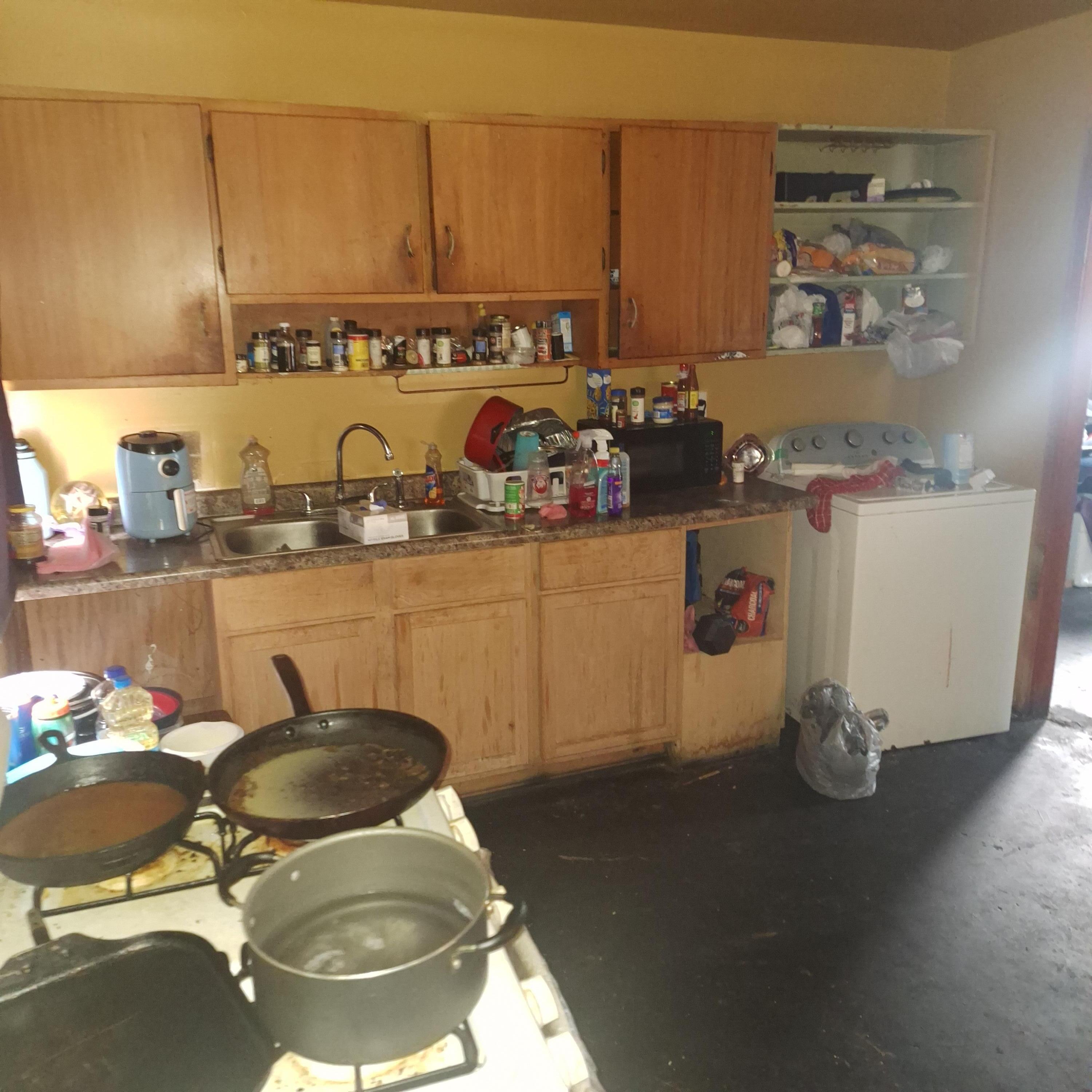 2173 Baker Street Gary, IN 46404 - Photo 3 of 7 a room with a sink and cabinets