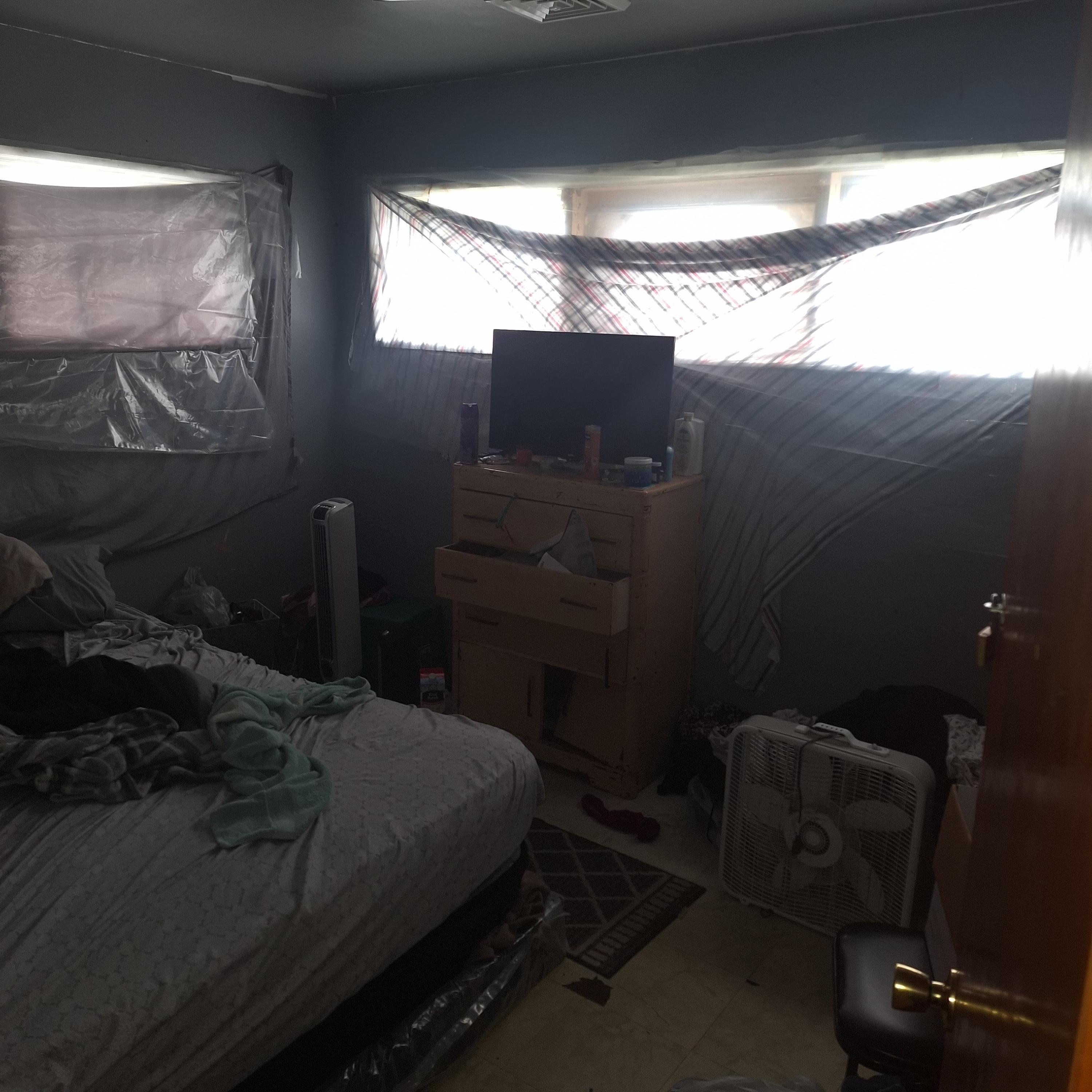 2173 Baker Street Gary, IN 46404 - Photo 5 of 7 a bedroom with a bed and a window