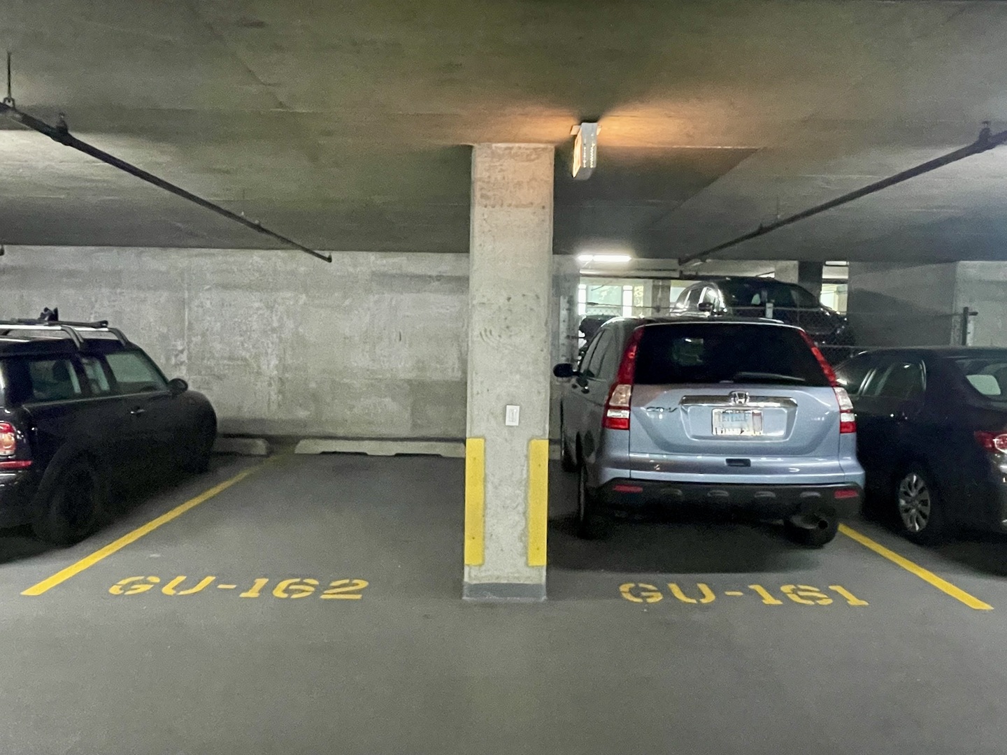 1629 South Prairie Avenue, Unit 801 Chicago, IL 60616 - Photo 27 of 33 a view of parking garage with cars parked