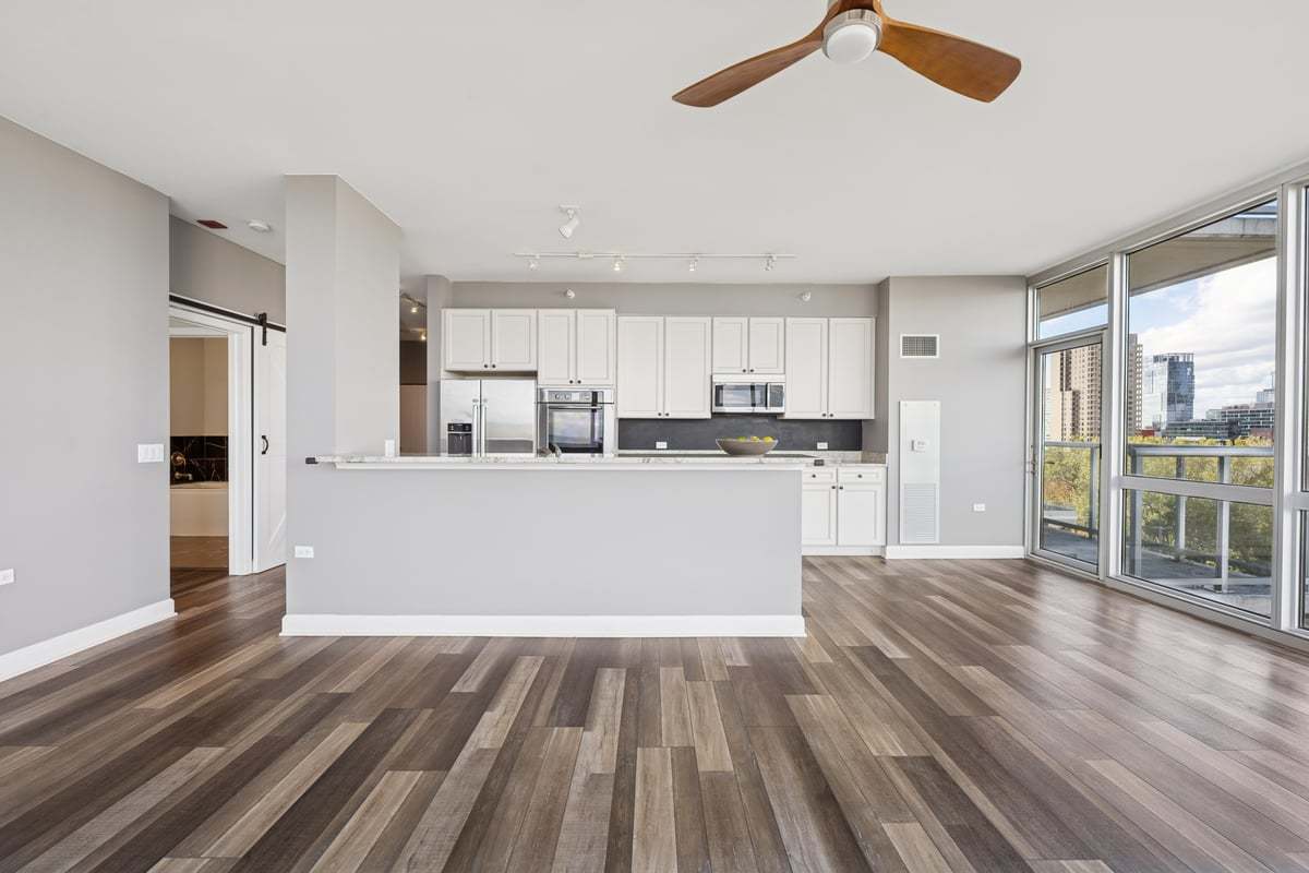 1629 South Prairie Avenue, Unit 801 Chicago, IL 60616 - Photo 7 of 33 a view of kitchen with wooden floor and window