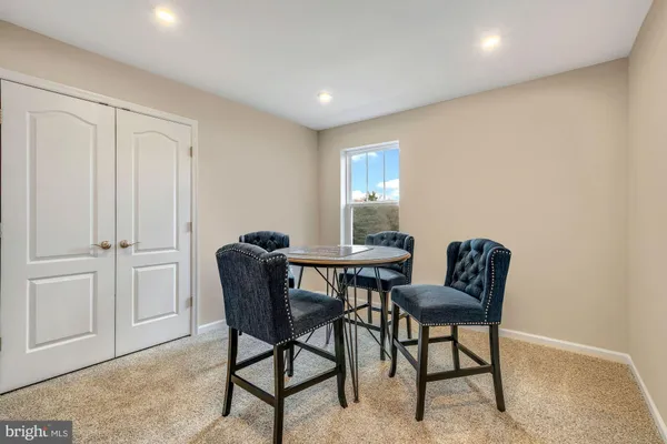 a view of a livingroom with furniture and entryway