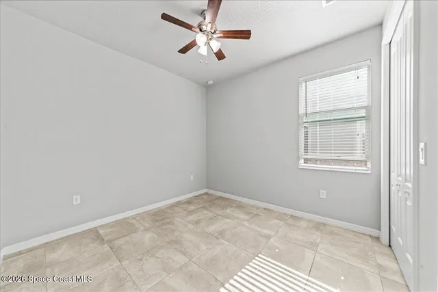 a bathroom with a sink a toilet a mirror and shower