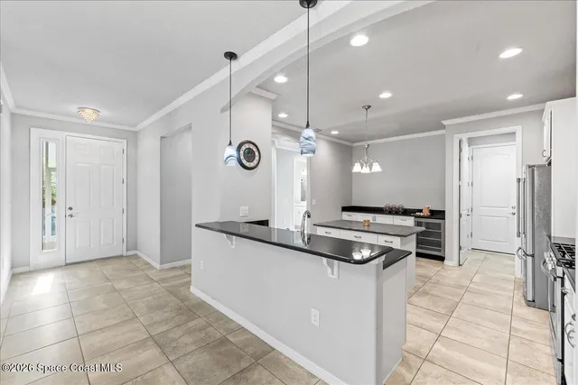 a kitchen with granite countertop a stove and a refrigerator
