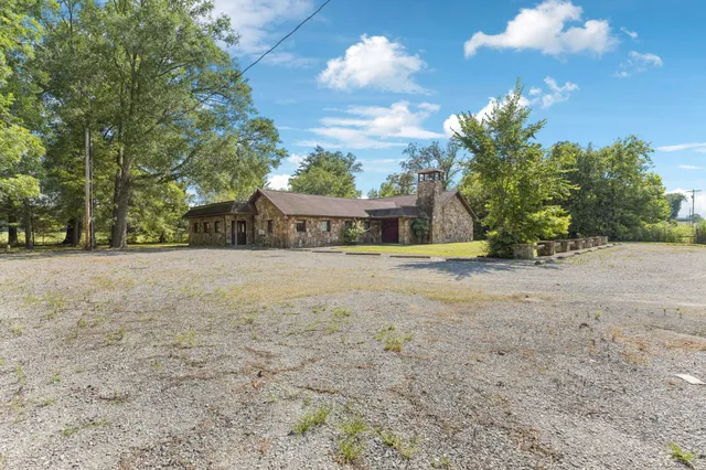 a view of the house with a yard
