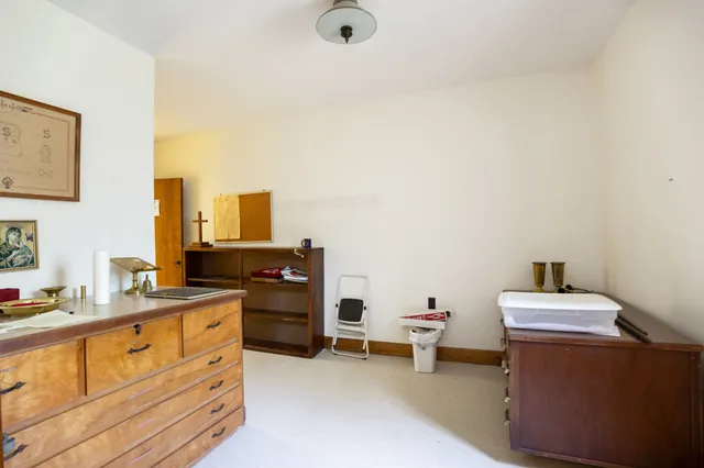 a room with a chair and gym equipment