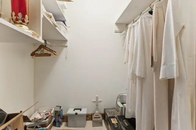 a bathroom with a window and a shower