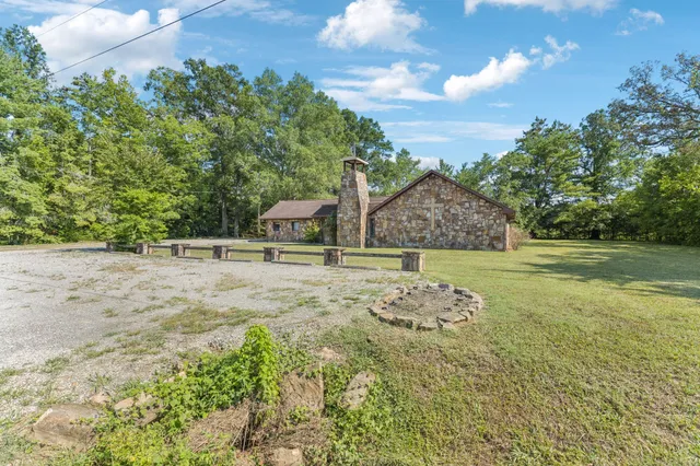 a view of a garden with a house